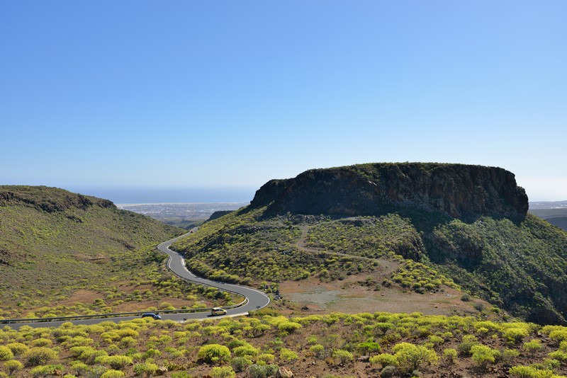 Long, sweeping road in the mountains of Gran Canaria looking down to the sea